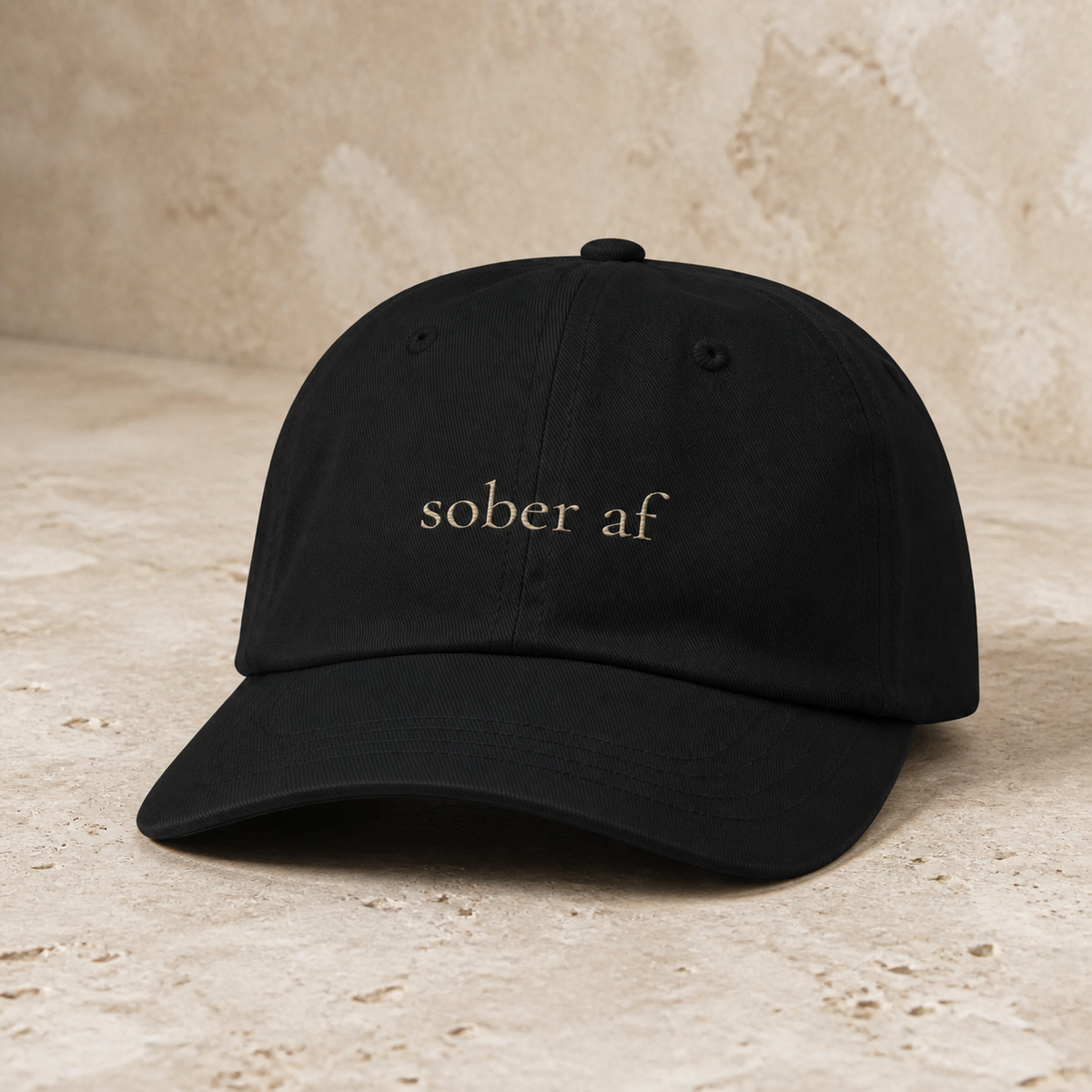 SOBER AF classic cap in Black on warm travertine