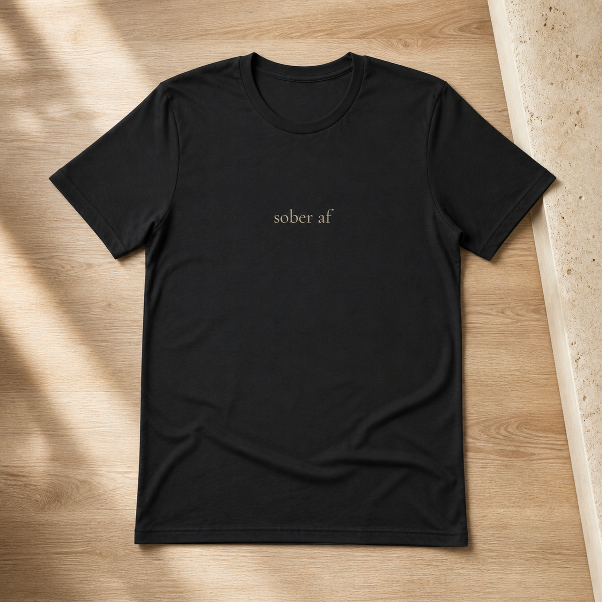 SOBER AF classic tee in Vintage Black on pale oak