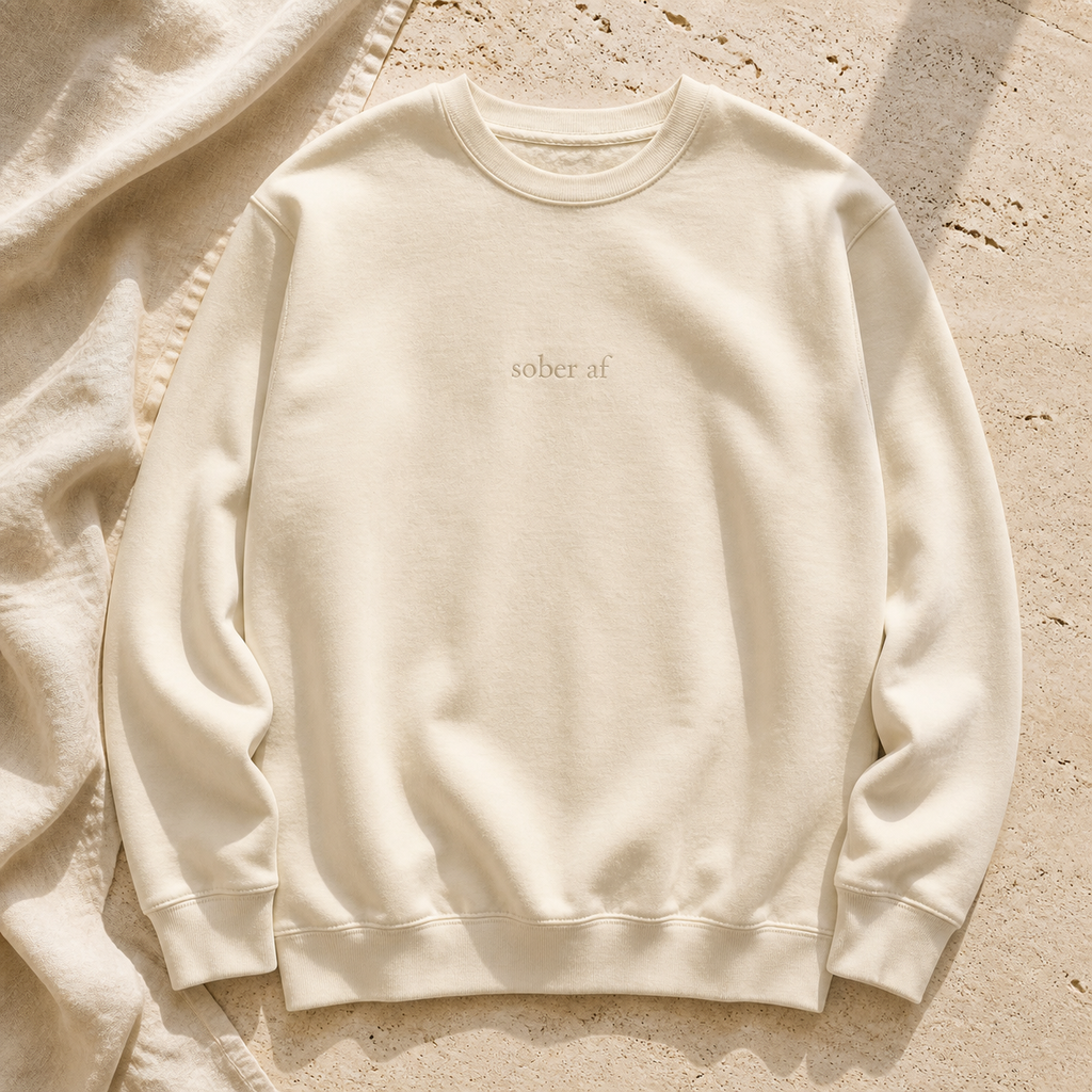 SOBER AF crewneck in Bone on warm travertine