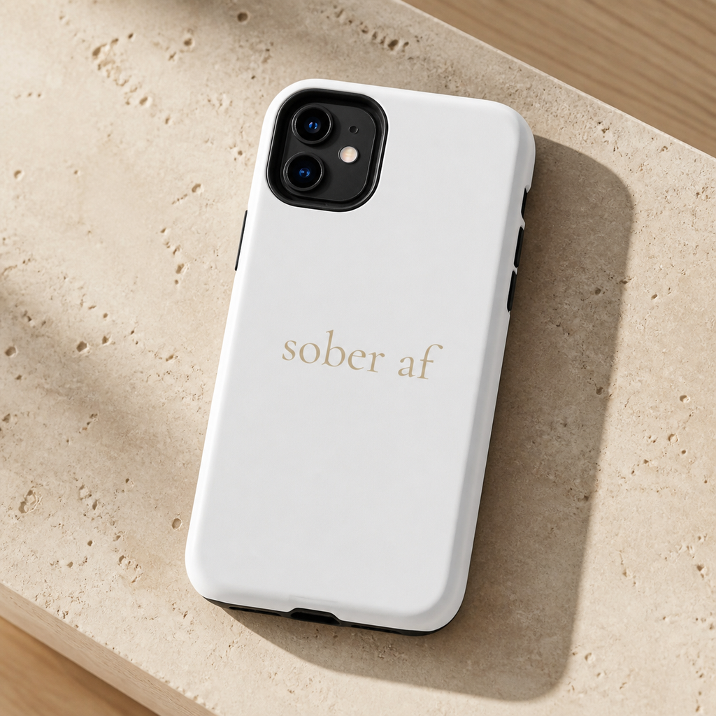 SOBER AF white iPhone case on travertine