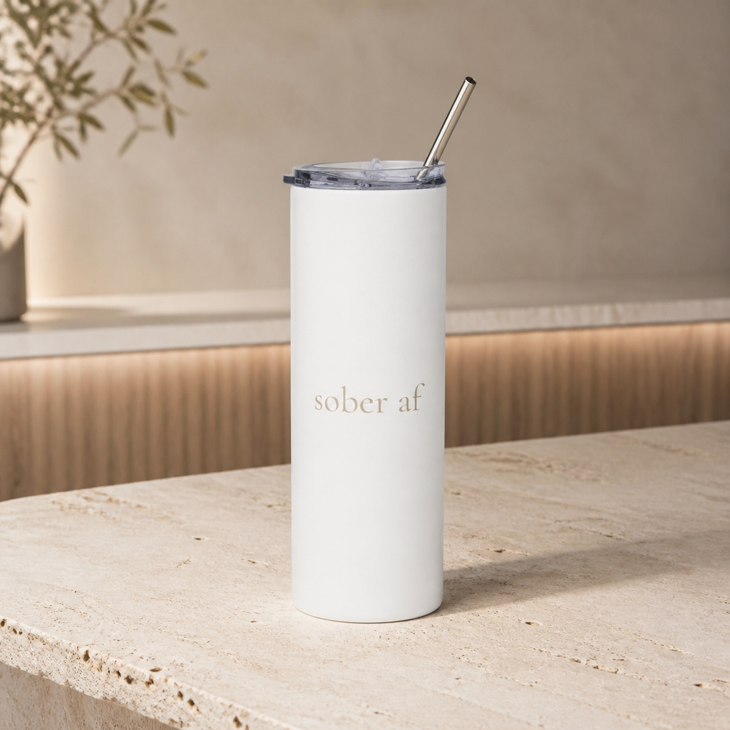 SOBER AF white tumbler on a warm travertine bar